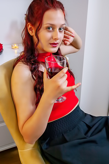 Olivia Honey teasingly strips her top, grabs her pussy, and orgasms screaming in red lingerie